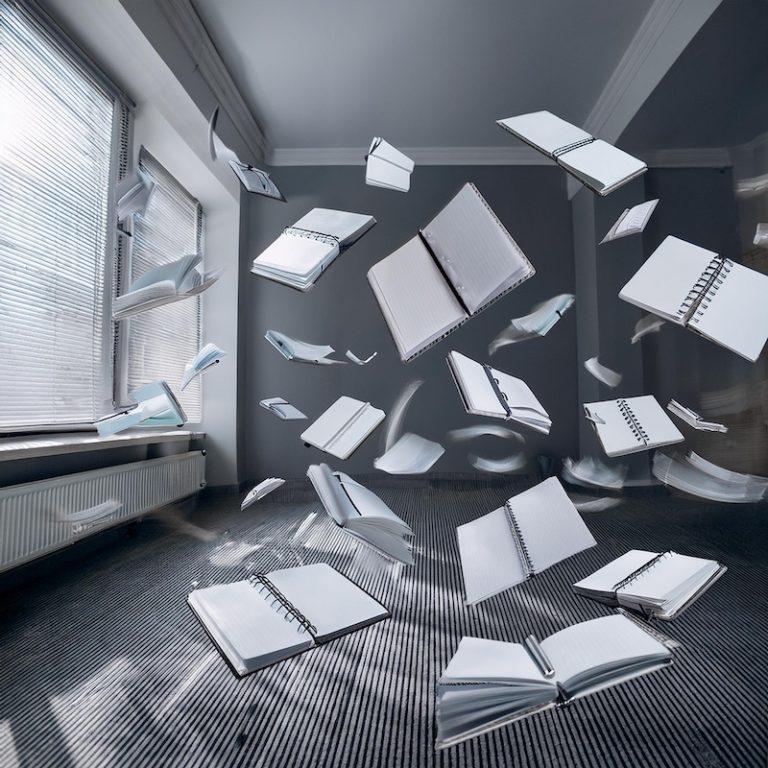 notebooks swirling around in storm, generated by Adobe Firefly